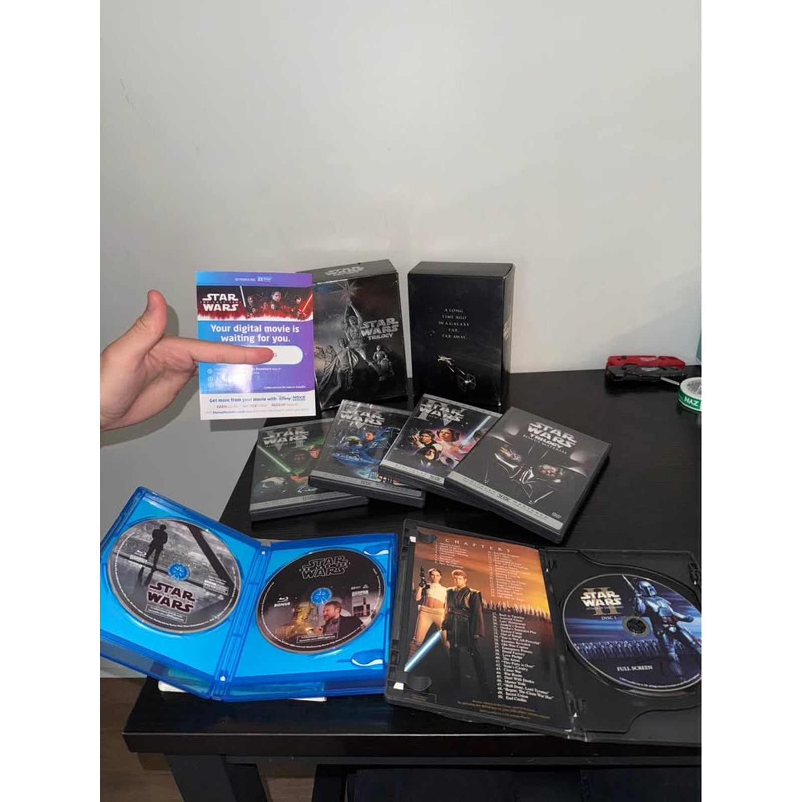 Star Wars Trilogy DVD Box Set, Episode II DVD, and The Last Jedi Blu-ray