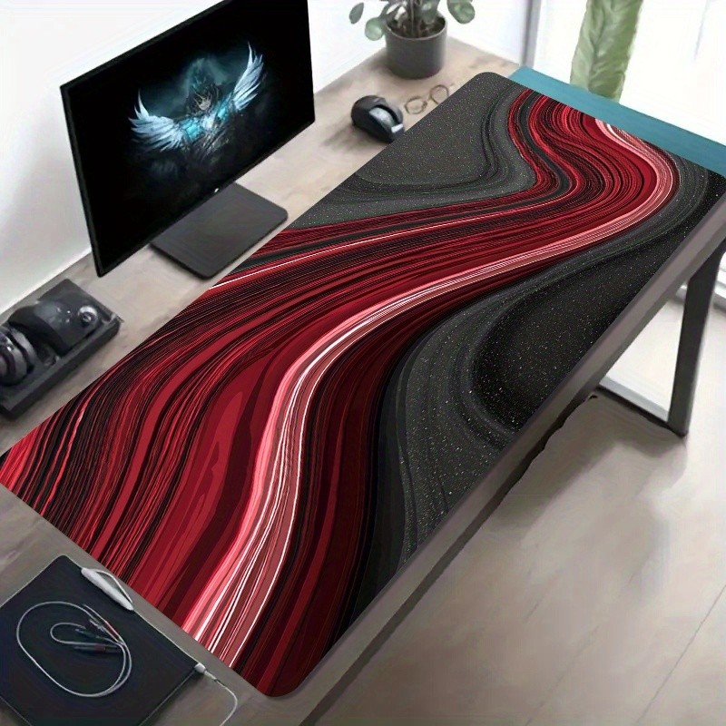 A Large Gaming Mouse Pad Featuring a Red And Black Fluid Art Design with Dynami