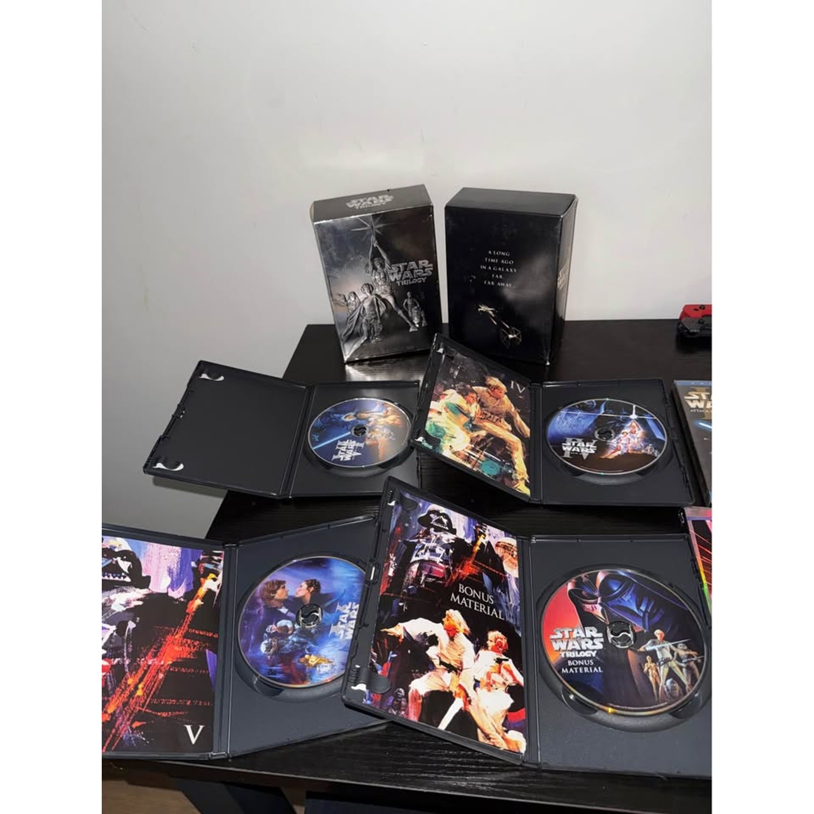 Star Wars Trilogy DVD Box Set, Episode II DVD, and The Last Jedi Blu-ray